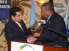 Ambassador Nassir Abdulaziz Al-Nasser, Permanent Representative of the State of Qatar to the UN and Chairman of G-77 for 2004, receiving an Appreciation Award from the Honourable W. Baldwin Spencer, Prime Minister and Minister for Foreign Affairs of Antigua and Barbuda and Chair of the G-77.