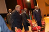 The G-77 Chair, The Honourable W. Baldwin Spencer (left), Prime Minister and Minister for Foreign Affairs of Antigua and Barbuda, and His Excellency Mr. Laurent Gbagbo, President of the Republic of Cte d'Ivoire, taking their seats at the podium during the opening ceremony of IFCC-XII.